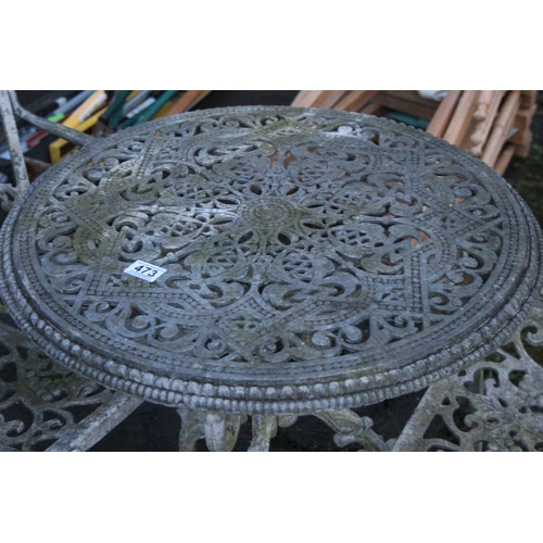 473 - Three piece cast metal garden table and chair set.