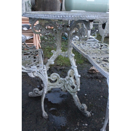 473 - Three piece cast metal garden table and chair set.