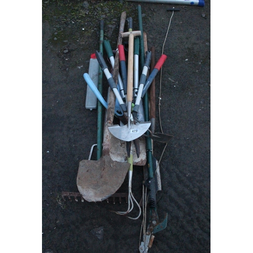 479 - A large lot of assorted tools including two builders shovels, garden rake and lots more.