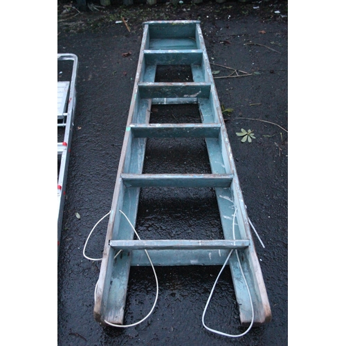 489 - A wooden folding step ladder.