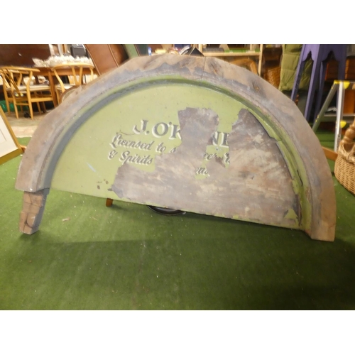 405 - A large antique wooden arch topped door panel 'J O'Kane - Licensed to Beer, Sprits etc' (a/f) measur... 