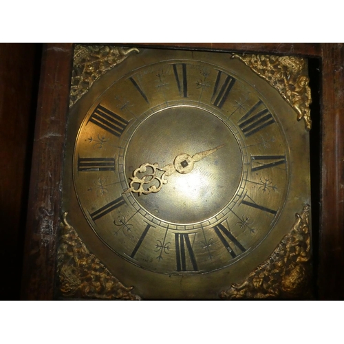 407 - An antique mahogany longcase clock with brass dial for restoration made by John Dixon Warwick.