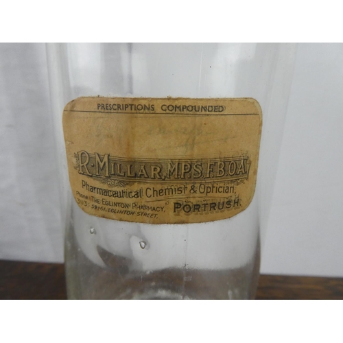 109 - An antique chemist bottle from Eglinton Pharmacy, Portrush.