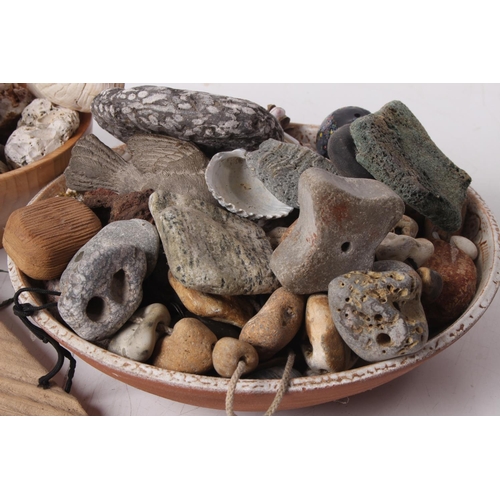 351 - A collection of Hag stones, shells and more.