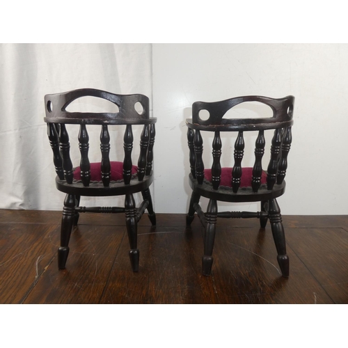 50 - A pair of miniature chairs.