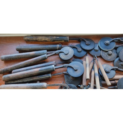 219 - A large collection of antique book binding / leather working tools.