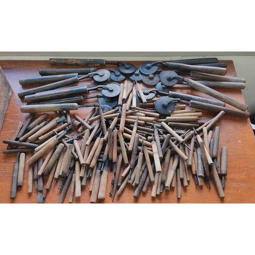 219 - A large collection of antique book binding / leather working tools.