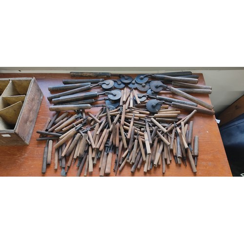 219 - A large collection of antique book binding / leather working tools.