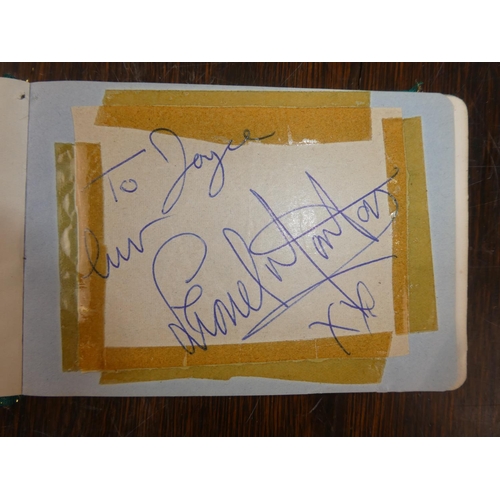 106 - A vintage autograph book containing an autographed picture of Tommy Cooper, Linda Lewis, Max Bygrave... 