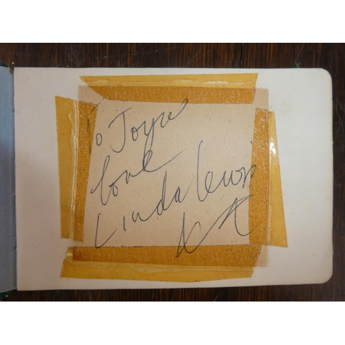 106 - A vintage autograph book containing an autographed picture of Tommy Cooper, Linda Lewis, Max Bygrave... 