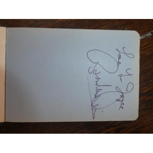 106 - A vintage autograph book containing an autographed picture of Tommy Cooper, Linda Lewis, Max Bygrave... 