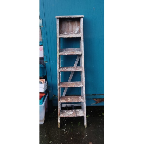 371 - A wooden step-ladder.