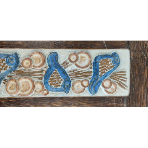 73 - A Marianne Stark pottery wall plaque of birds. 33x8cm.