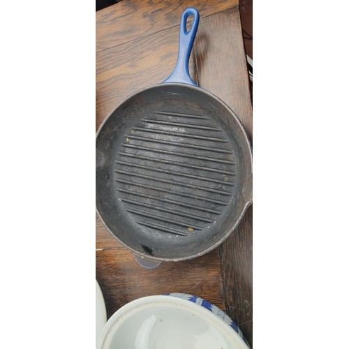 223 - Three pieces of Le Creuset kitchen ware and a blue and white ceramic lidded pot.