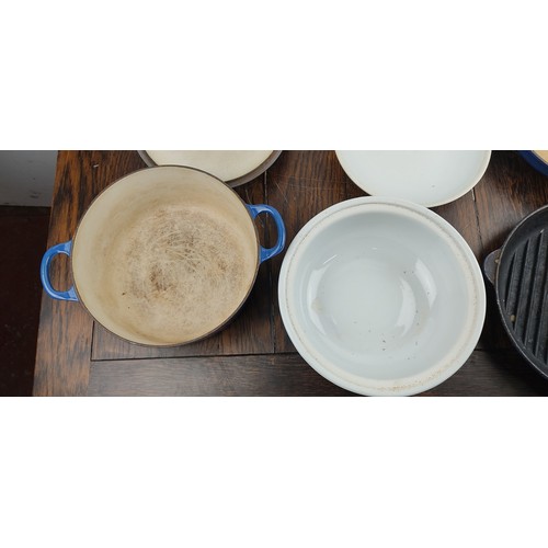 223 - Three pieces of Le Creuset kitchen ware and a blue and white ceramic lidded pot.