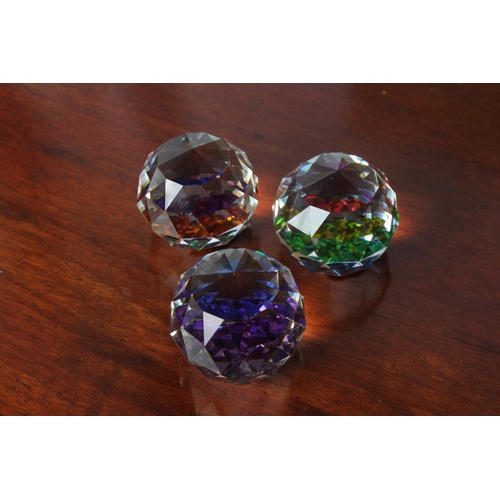 27 - Three crystal Vitrail rainbow faceted ball paperweights, measuring 4cm tall.