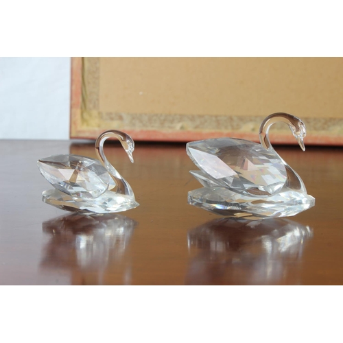 30 - Two Swarovski crystal swans.