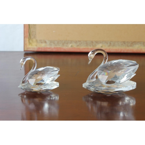 30 - Two Swarovski crystal swans.