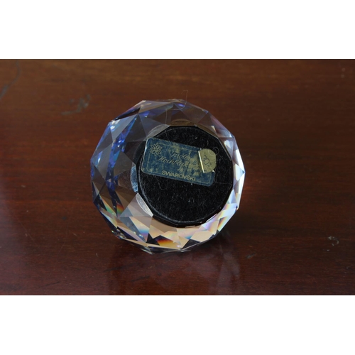 35 - A Swarovski crystal blue/purple faceted ball paperweight, measuring 5 1/2cm height.