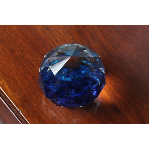 35 - A Swarovski crystal blue/purple faceted ball paperweight, measuring 5 1/2cm height.