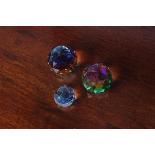 36 - Two crystal Vitrail rainbow paperweights, measuring 3cm height and another.