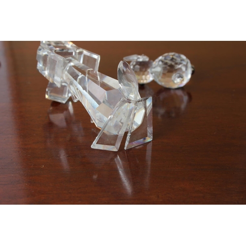 37 - A Swarovski crystal dog (a/f) and two Swarovski crystal cat ornaments.