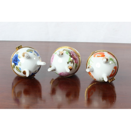 43 - Three ceramic egg trinket boxes.