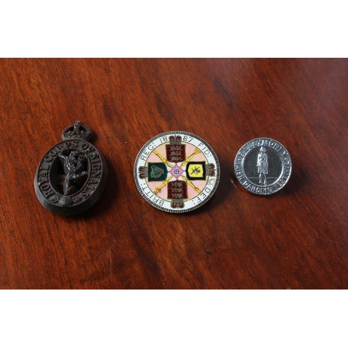 46 - An antique enamelled1887 Queen Victoria coin brooch (a/f), a Royal Corps of Signals cap badge and an... 