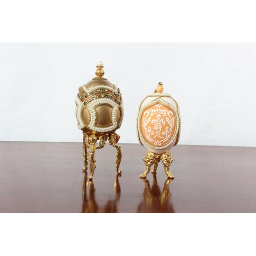 48 - Two Faberge style egg shaped trinket boxes.