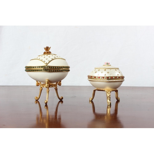 50 - Two Faberge style egg shaped trinket boxes.