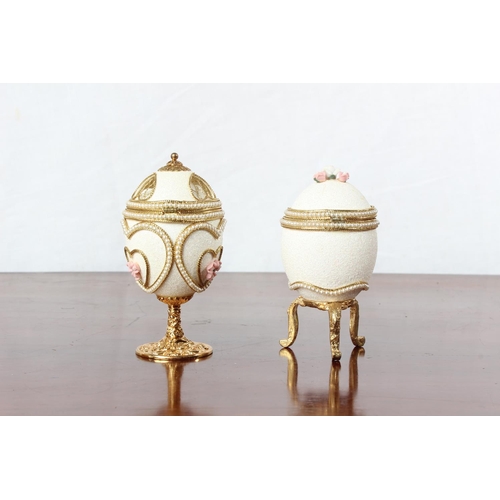 51 - Two Faberge style egg shaped trinket boxes.