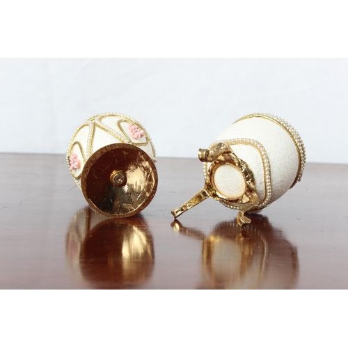 51 - Two Faberge style egg shaped trinket boxes.