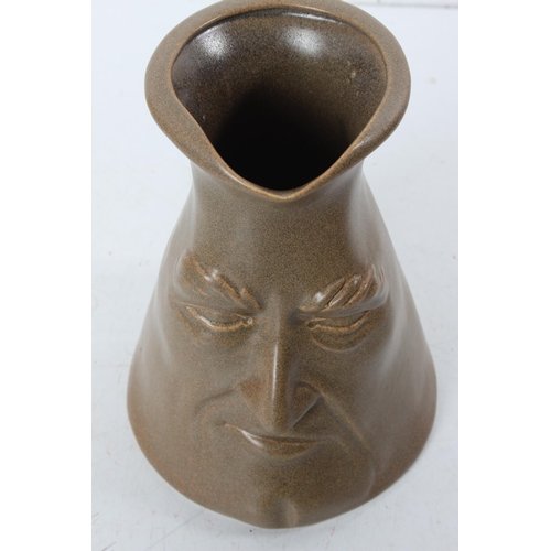 88 - An unusual mask jug.