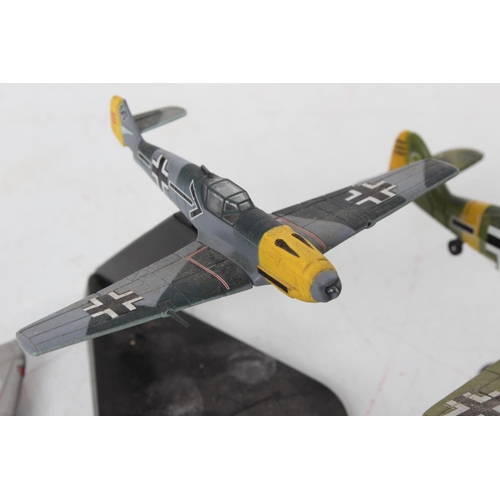 94 - Two diecast military planes on presentation stands 'Maisto Messerschmitt Me-109G' and 'Mirage III' a... 