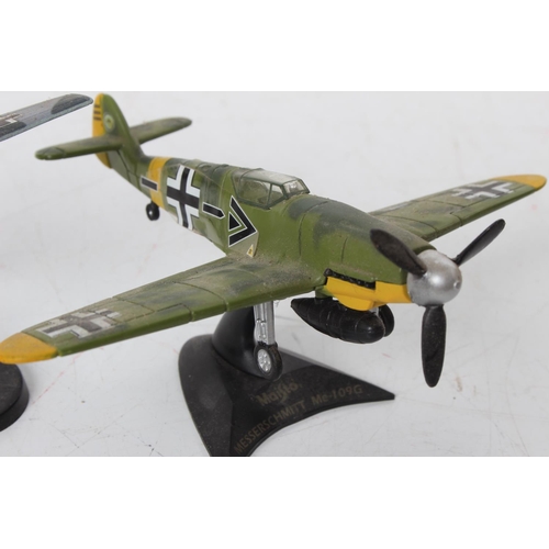 94 - Two diecast military planes on presentation stands 'Maisto Messerschmitt Me-109G' and 'Mirage III' a... 