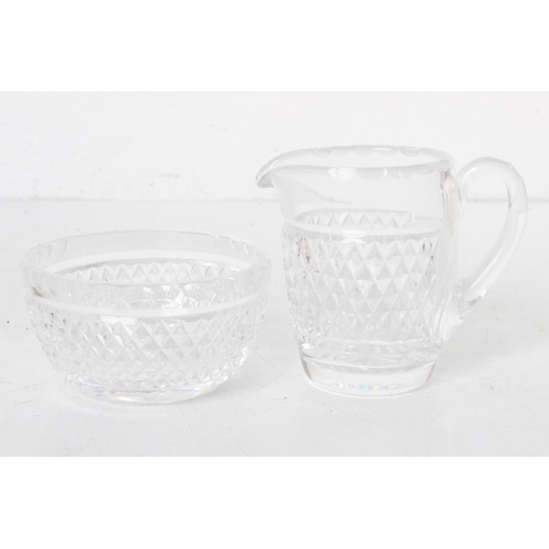 106 - A Waterford Crystal milk jug and sugar bowl.