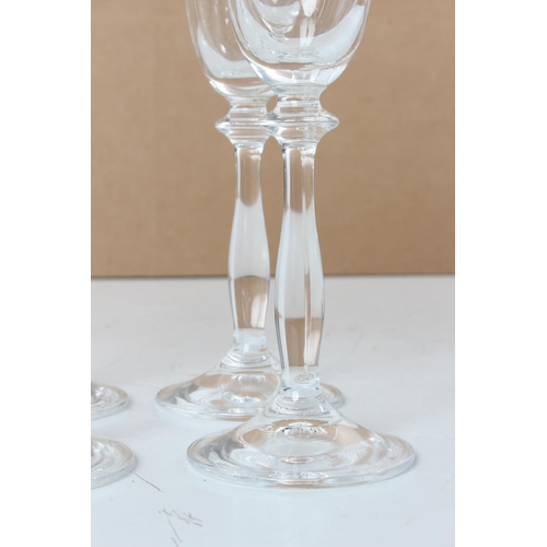 110 - A set of six vintage etched glass champagne flutes.