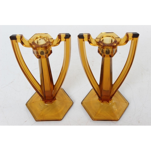 114 - A pair of vintage amber candlesticks (a/f).