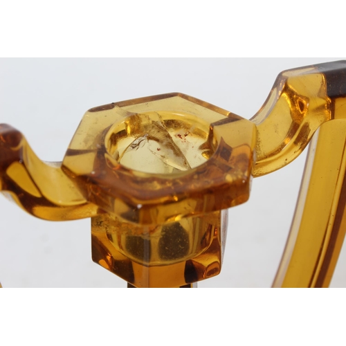 114 - A pair of vintage amber candlesticks (a/f).