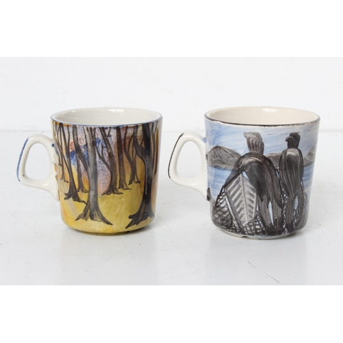 115 - A pair of Irish Carrigaline hand painted pottery mugs.