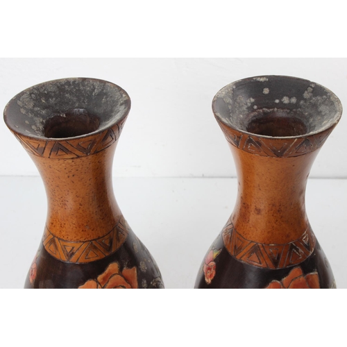 124 - A pair of pokerwork hand painted wood vases with floral design, measuring 30cm tall.