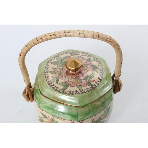 125 - A vintage Maling 'Azalea' patterned biscuit barrel with rattan handle.