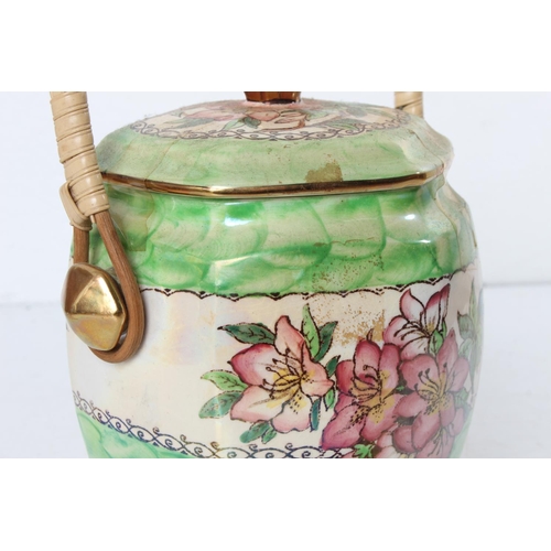 125 - A vintage Maling 'Azalea' patterned biscuit barrel with rattan handle.