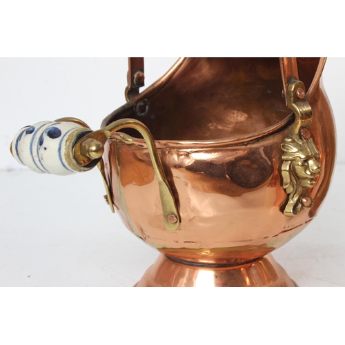 132 - A collection of copper and brass ware including a Garrison kettle and lots more.