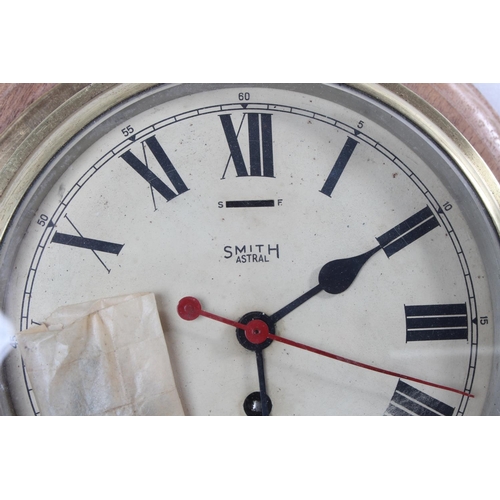 171 - A stunning antique brass cased Smiths Astral ships bulkhead clock, mounted on wooden base.