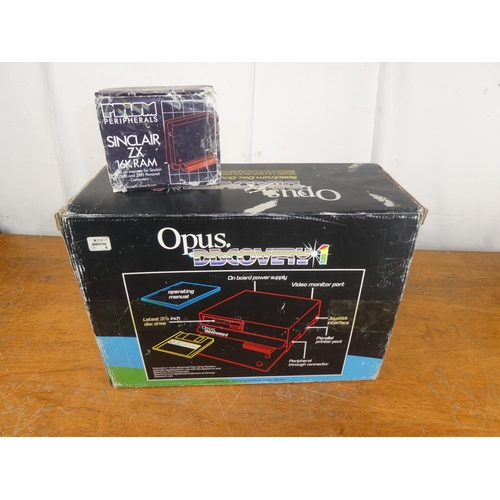 202 - A vintage boxed Opus Discovery 1 console, with boxed Prism Peripherals Sinclair ZX 16k ram.