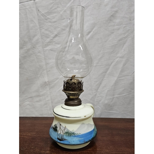 264 - A decorative antique finger oil lamp.