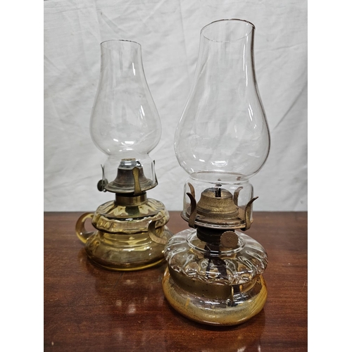 268 - 2 antique finger oil lamps with clear glass fonts.