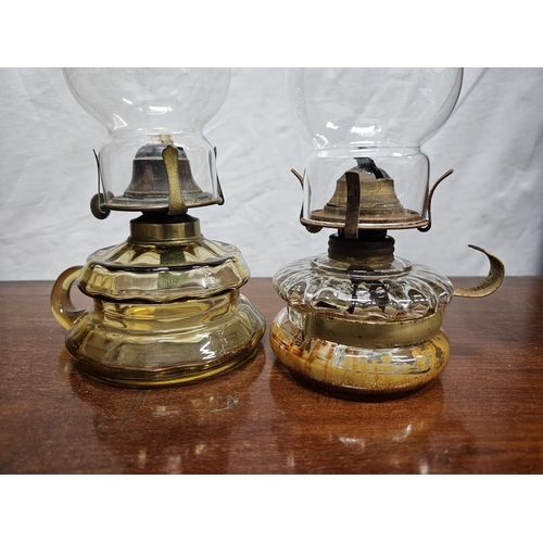 268 - 2 antique finger oil lamps with clear glass fonts.