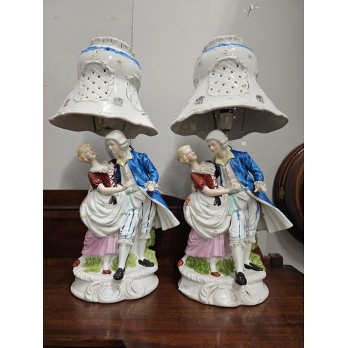 269 - A large pair of antique style ceramic table lamps.